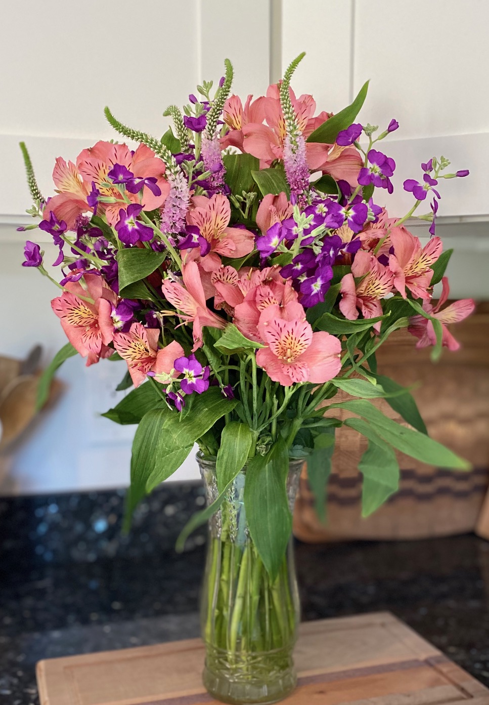 Pink Peruvian Lilies and purple speedwells