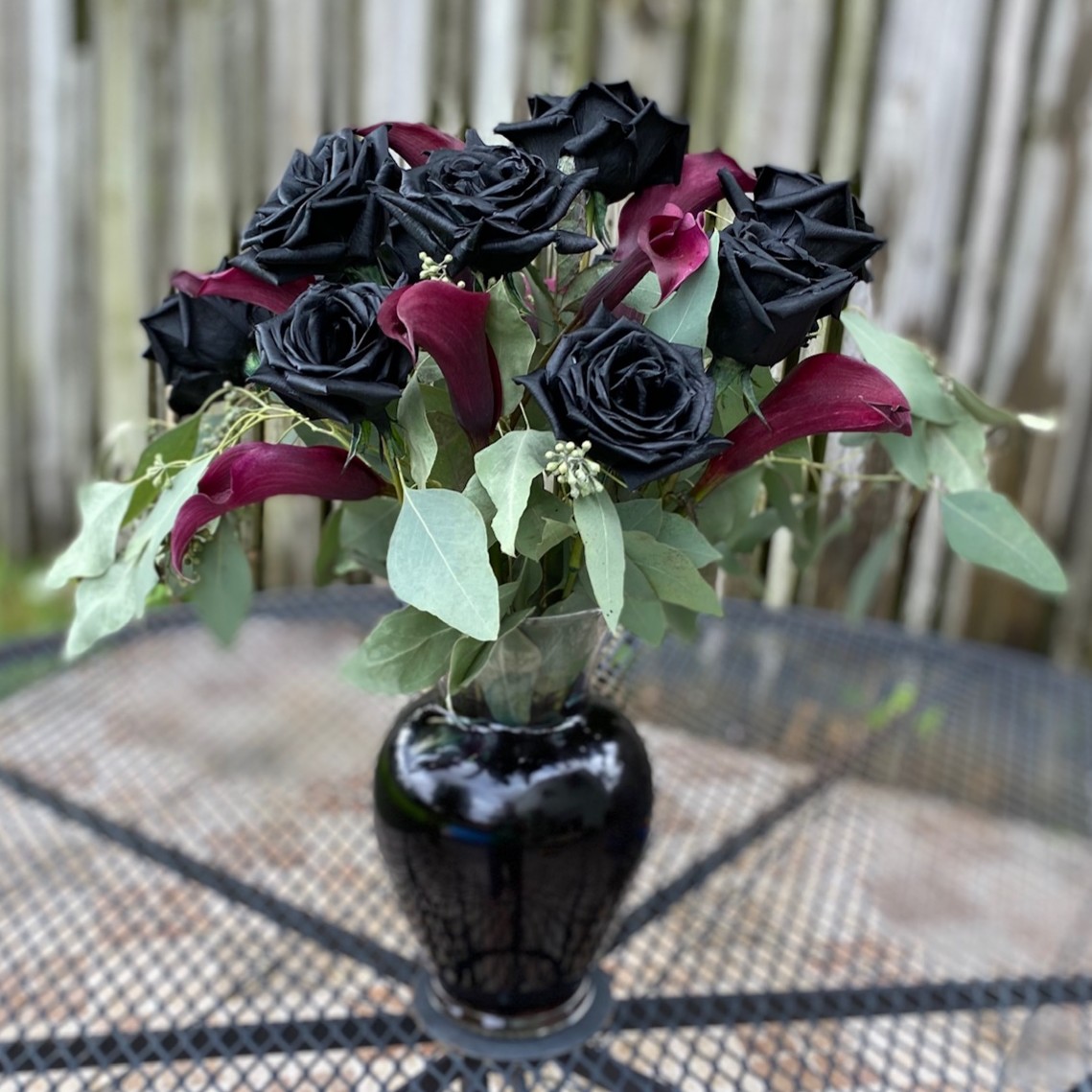 Black roses and calla lilies