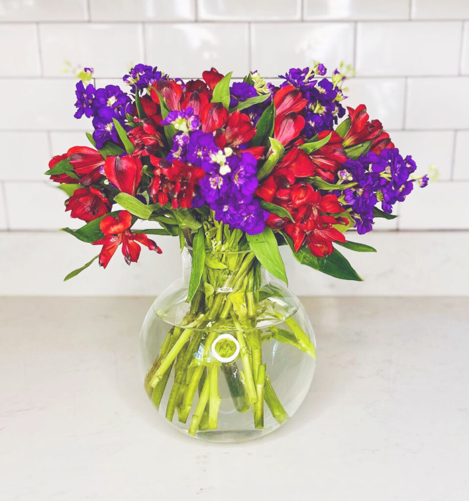 red lilies and purple stock