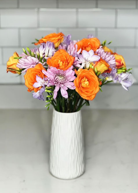 Bright orange roses in white vase, summer and spring bouquets, bright and cheerful flowers, pink mums, purple Chrysanthemums, purple freesia