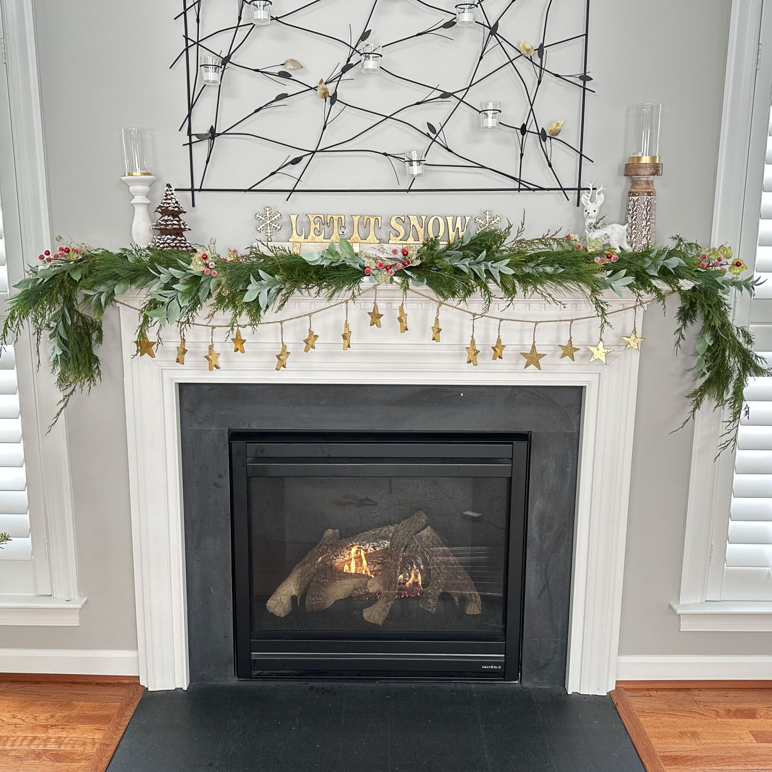 Holiday garland, live garland, cypress leaves/stems, pine leaves/stems, Dusty Ruscus leaves/stems, Holiday Floral accents with berries and gold swirls, gold star string garland, holiday decor, christmas, fireplace garland, archway garland